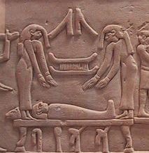 Mourners, probably Isis and Nephthys, throw Their hair over the Osiris