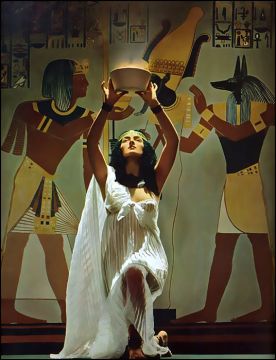 A priestess making offering; photo by Victor Keppler